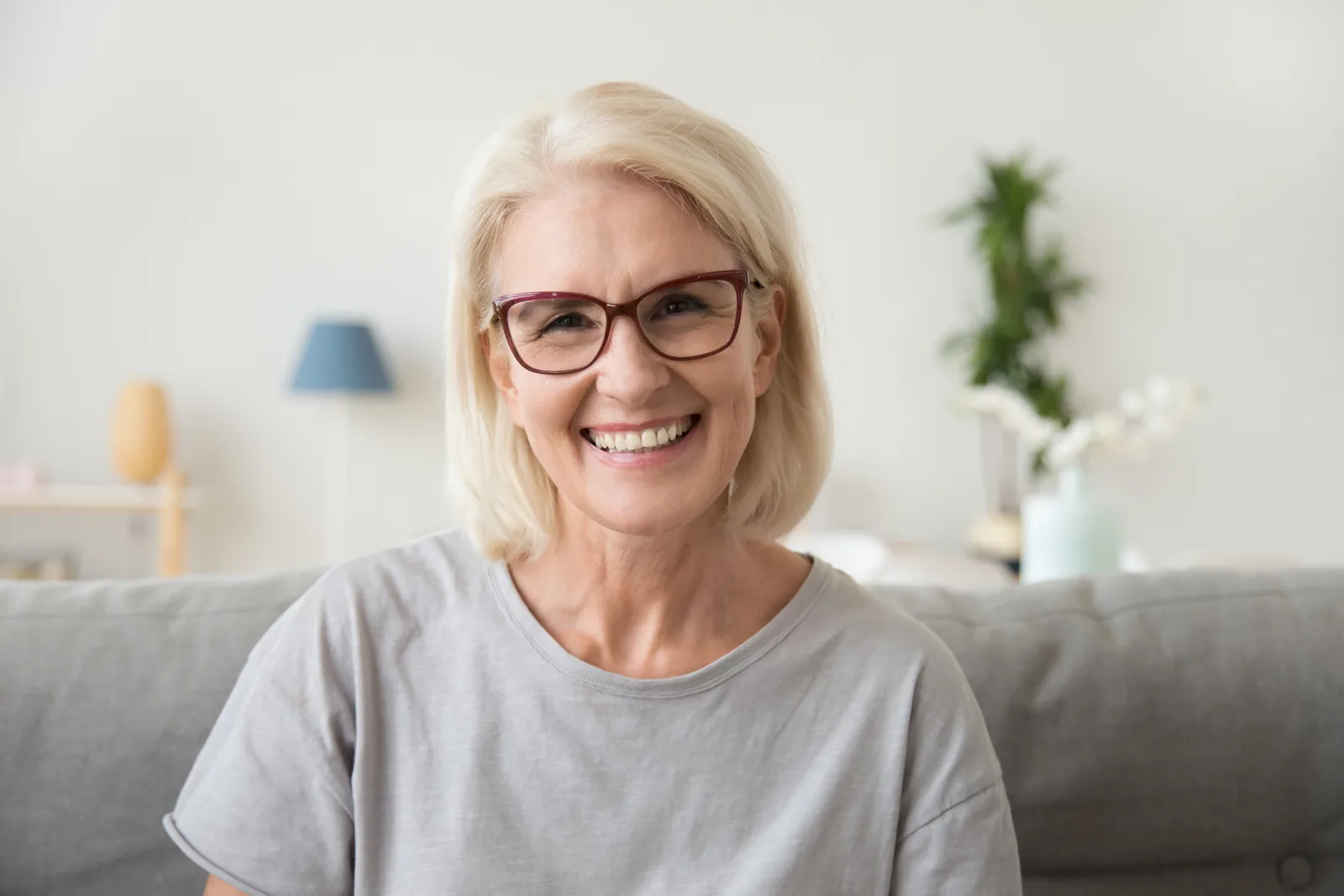 Woman smiling in a bright interior
